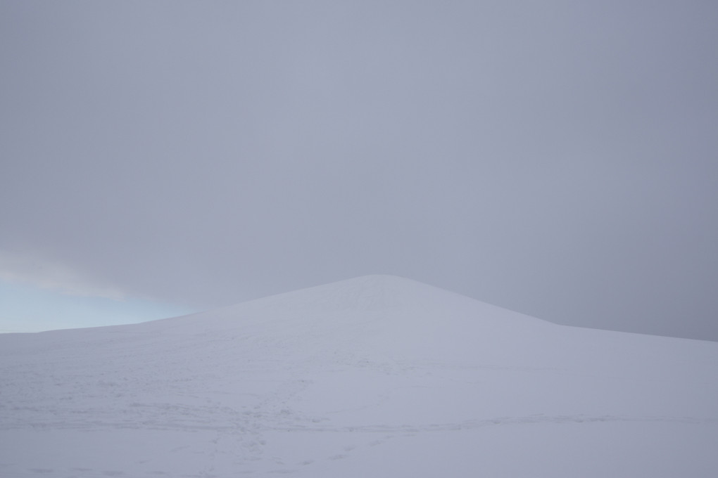 Gray sky, snow hill