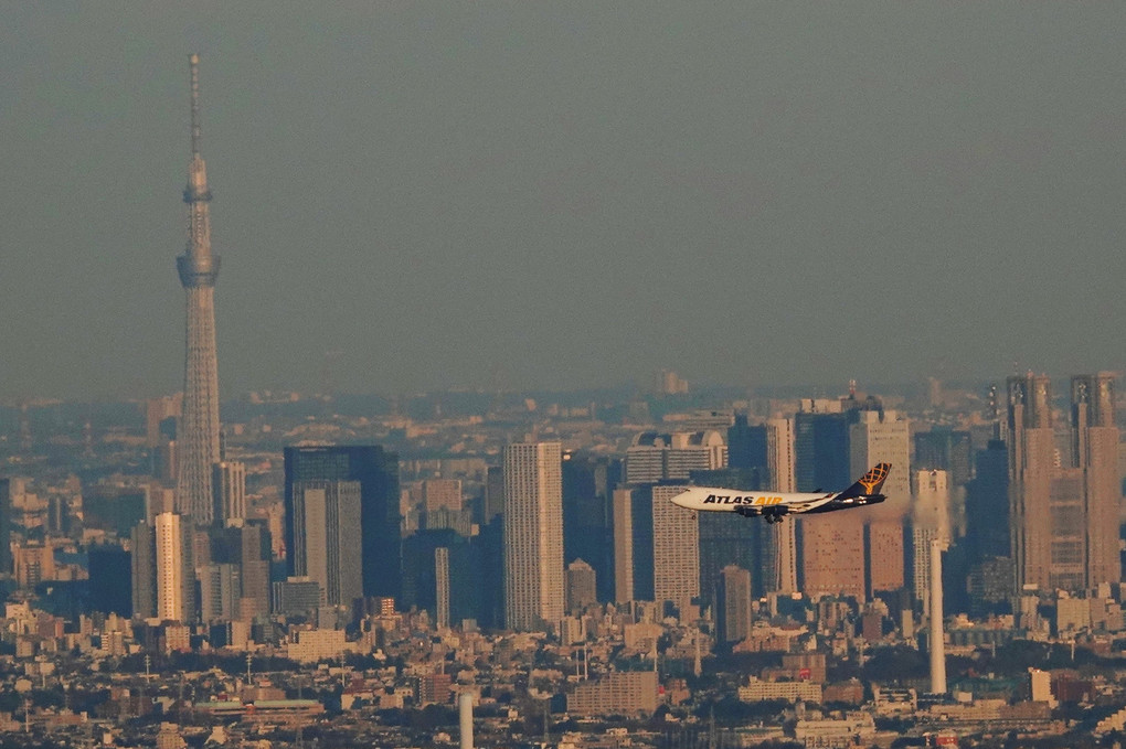 Air cargo flying over Tokyo