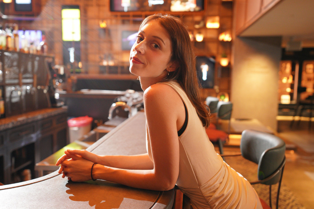 Lydia sitting at the bar counter